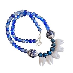Elegant Beaded Necklace with Tooth Charms